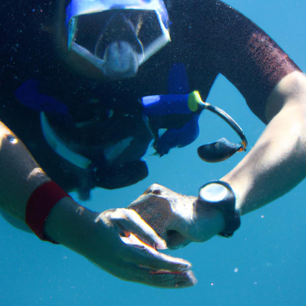 Person wearing dive computer underwater